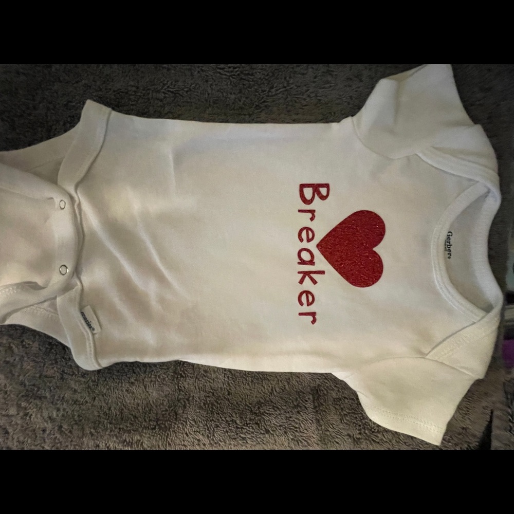 Heart breaker baby onesie